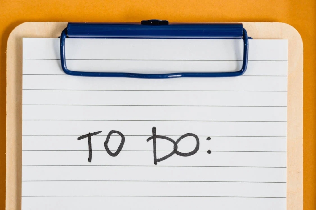 Clipboard with a sheet of paper. Written on it is "To Do:"